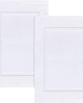Plush, absorbent, and made from 100% ring-spun cotton, these spa-style bath mats are the same ones our guests step onto after a shower. Soft underfoot and fully washable, they're lightweight, reversible, and designed for everyday comfort.