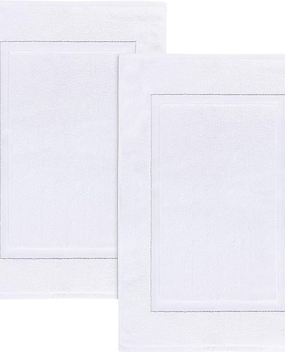 Plush, absorbent, and made from 100% ring-spun cotton, these spa-style bath mats are the same ones our guests step onto after a shower. Soft underfoot and fully washable, they're lightweight, reversible, and designed for everyday comfort.